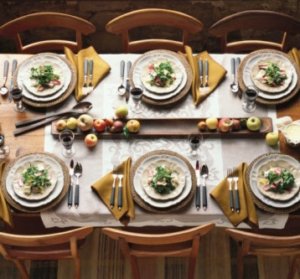 Laid table with salad, fruit and red wine (France)
